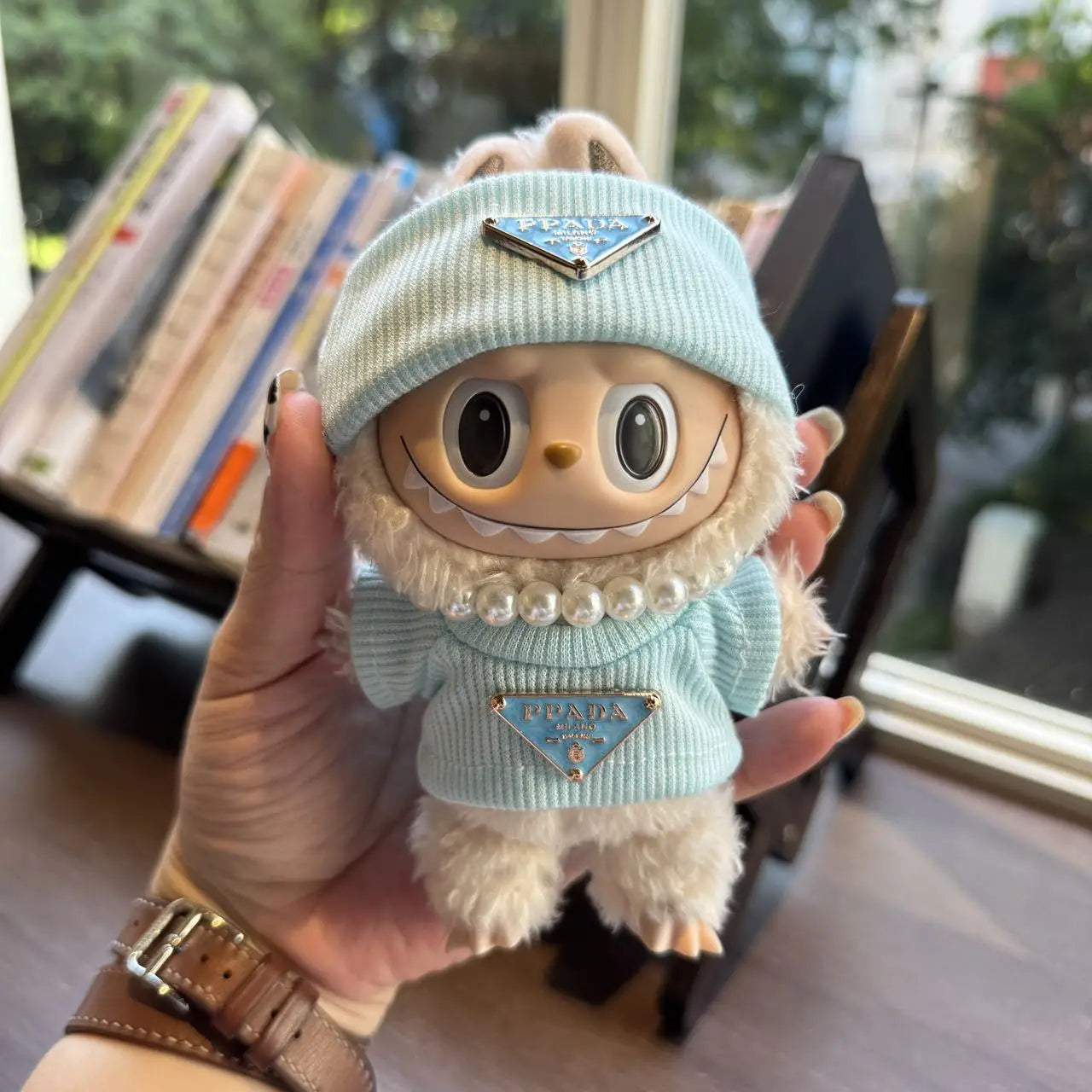 Prada sweater outfit with pearl necklace