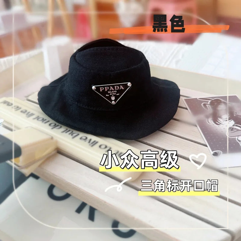 Prada overall and bucket hat