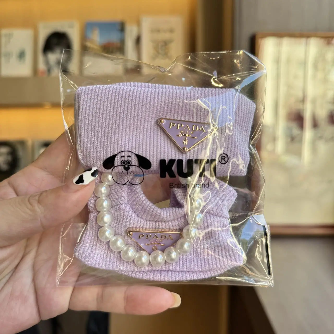 Prada sweater outfit with pearl necklace