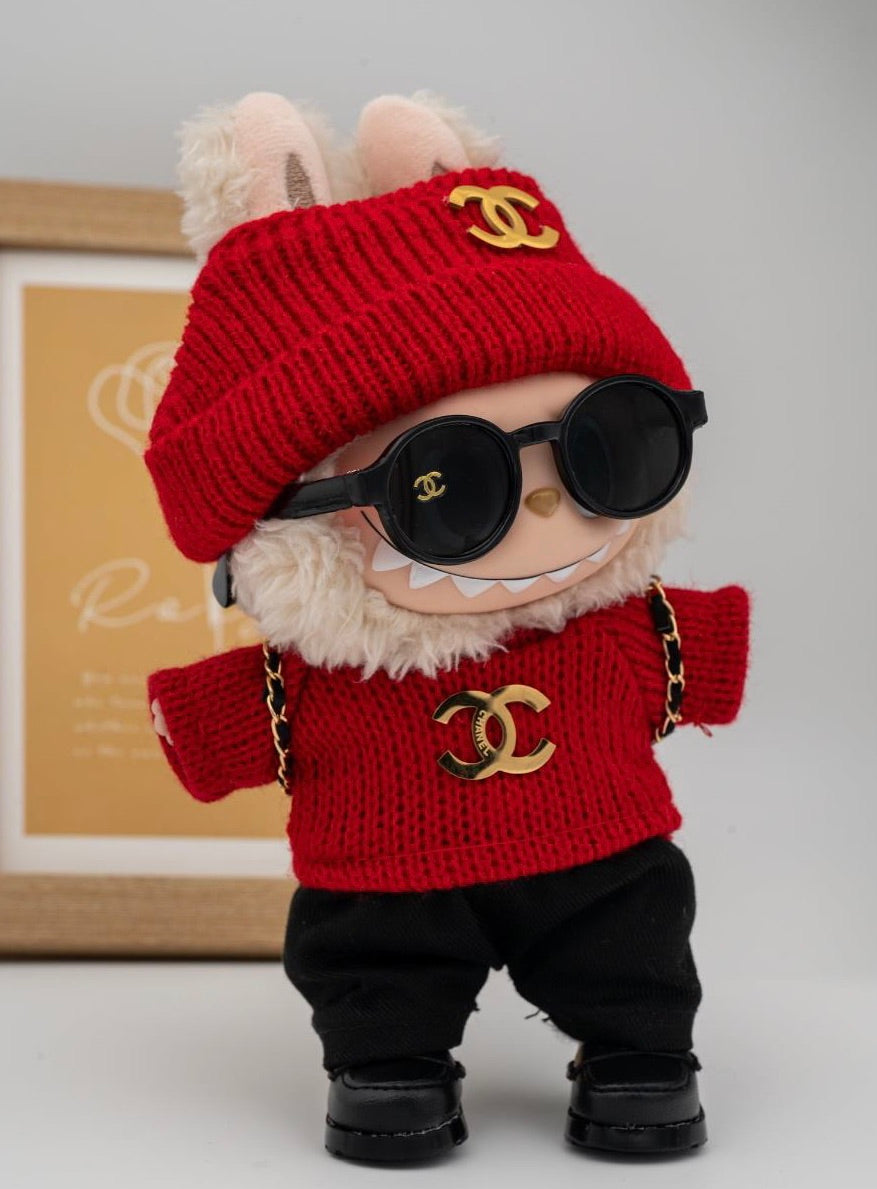Red Chanel sweater and backpack