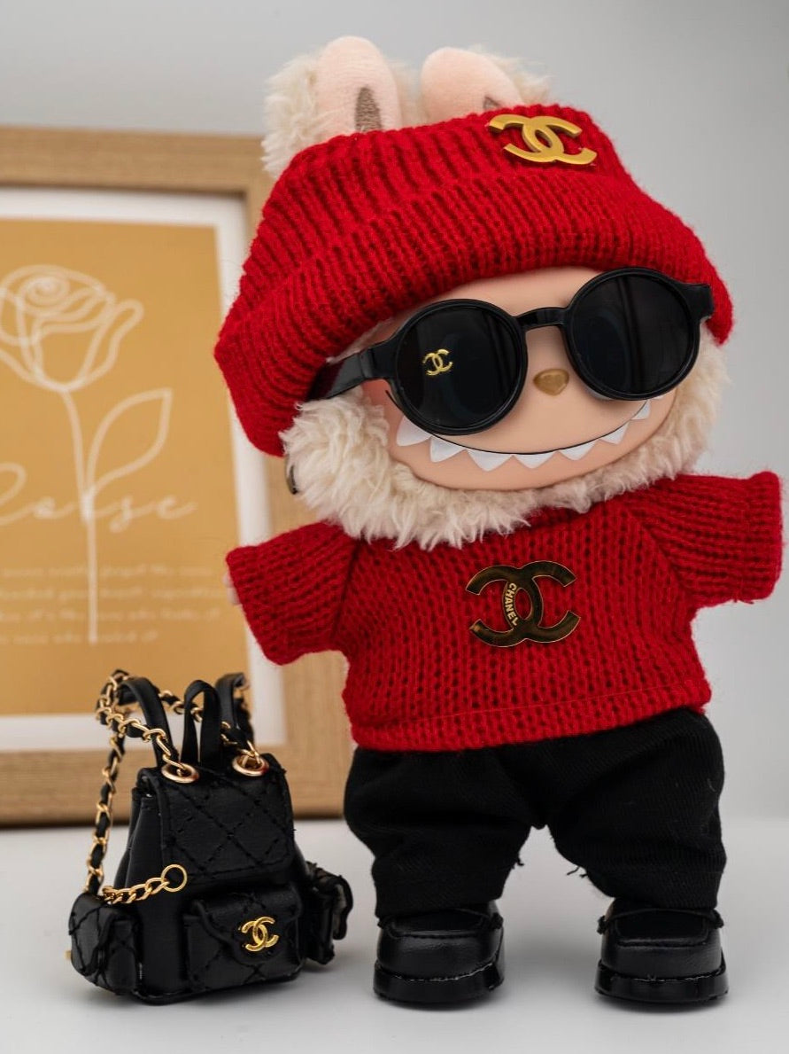 Red Chanel sweater and backpack