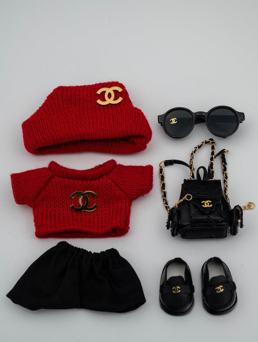 Red Chanel sweater and backpack