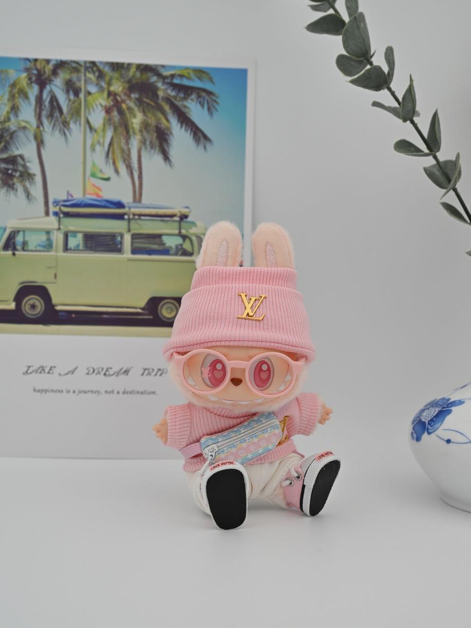Louis Vuitton pink ensemble and multicolor fanny pack