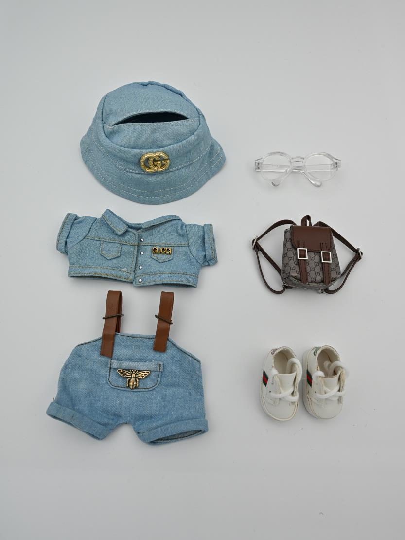 Gucci light denim ensemble and backpack