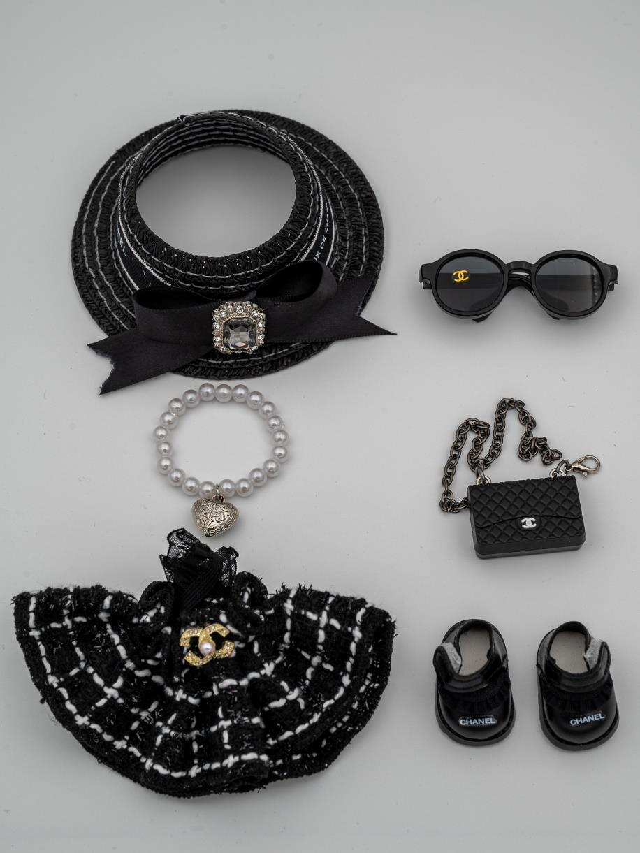 Chanel tweed dress and jeweled hat