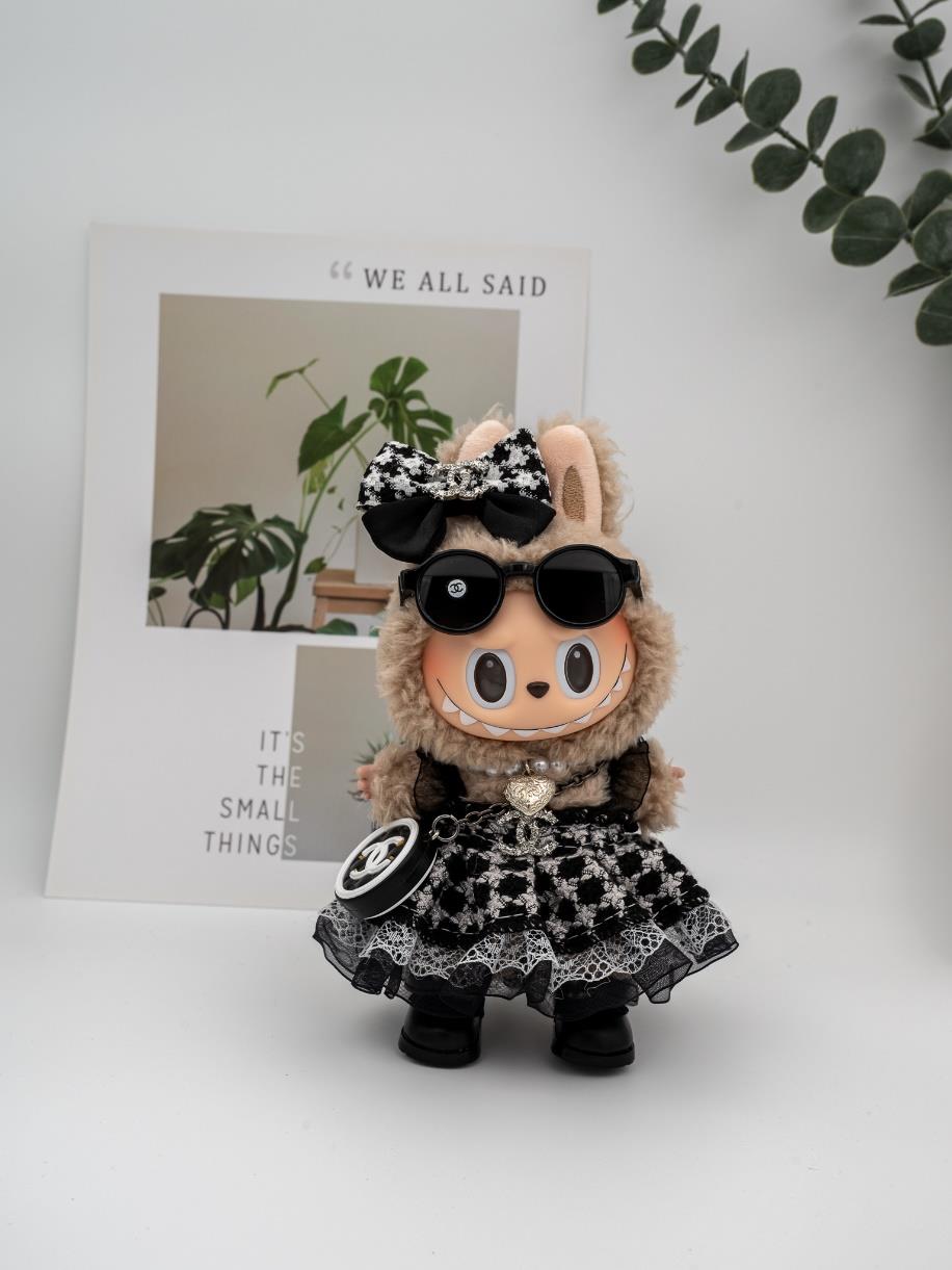 Chanel tweed black dress and heart pearl necklace