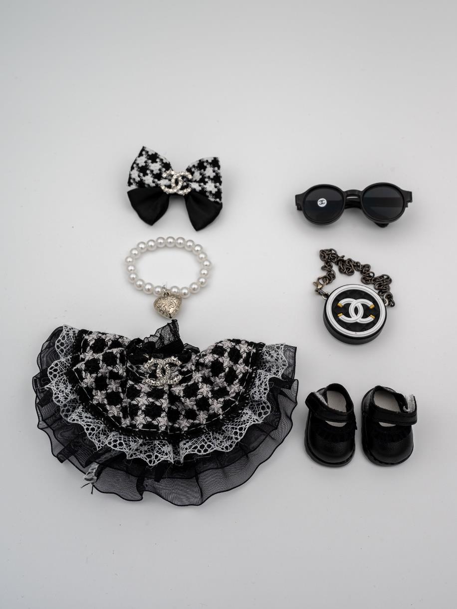 Chanel tweed black dress and heart pearl necklace