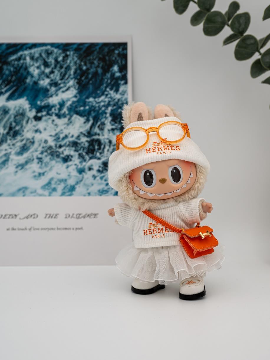 Hermes white skirt and orange Constance ensemble