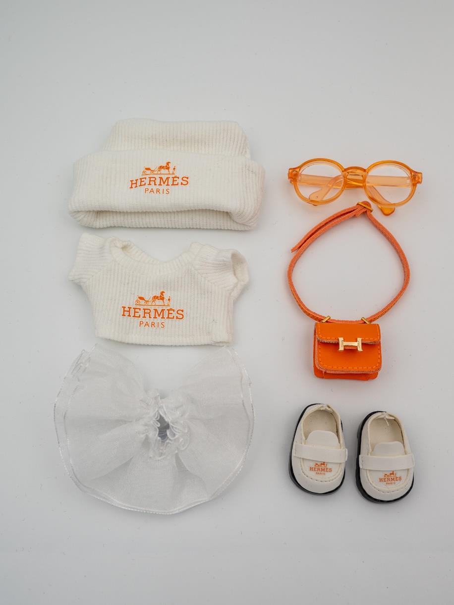 Hermes white skirt and orange Constance ensemble