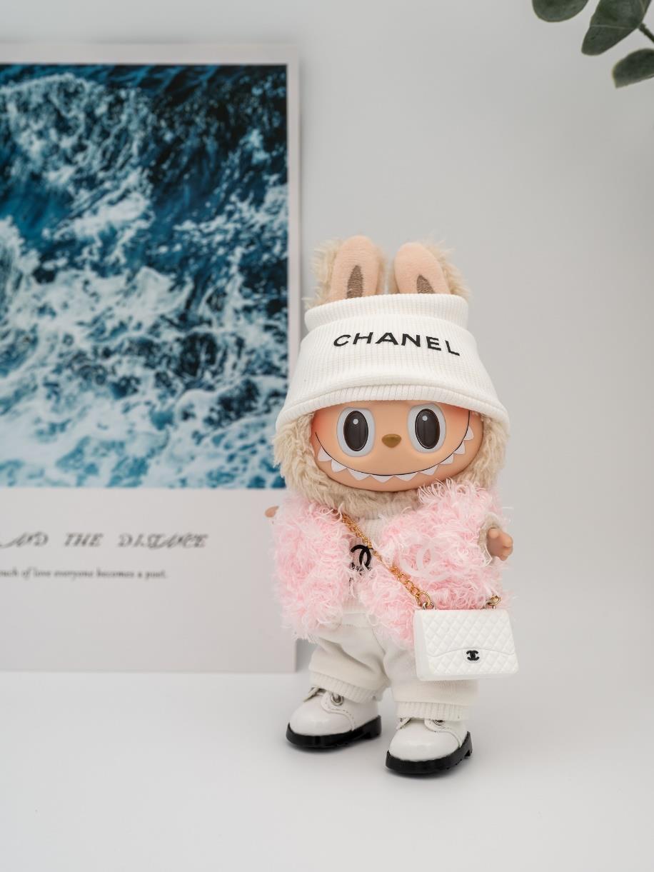 Chanel pink fur jacket and white bag