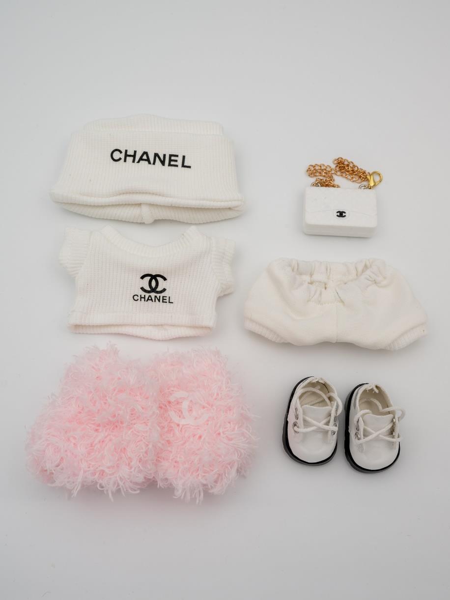 Chanel pink fur jacket and white bag