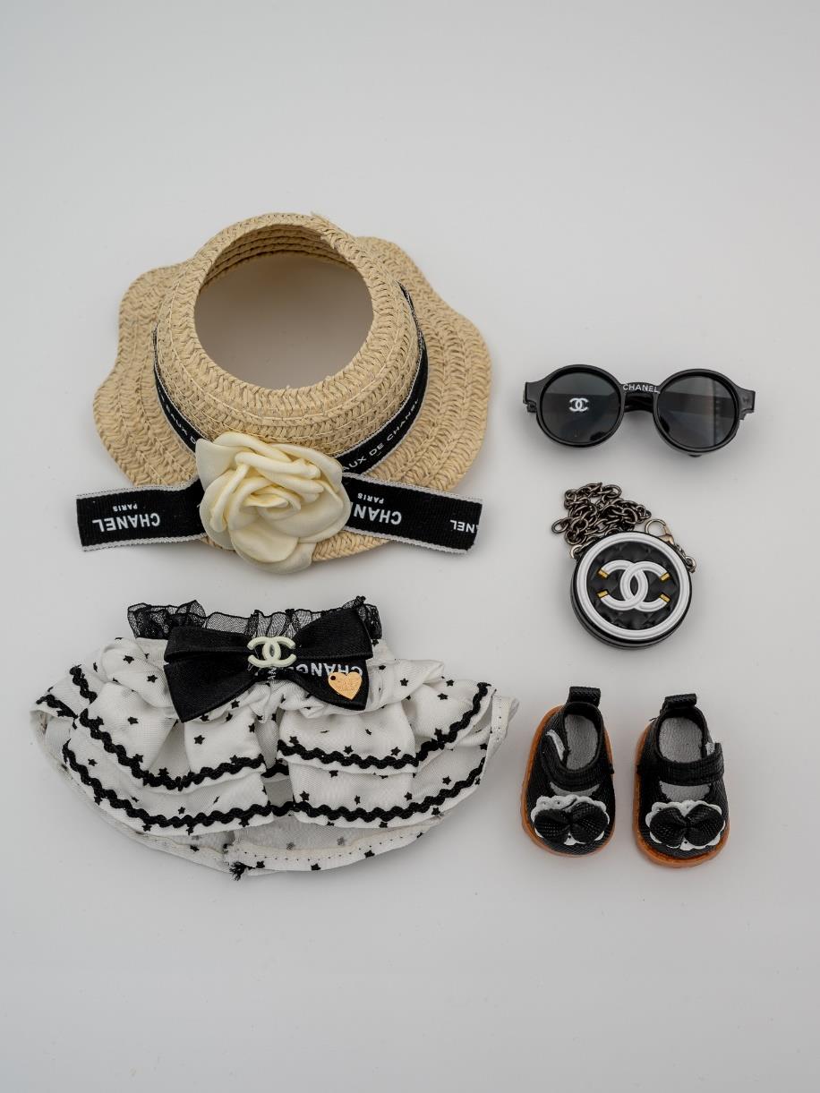 Chanel white dress and black hem design with stars ensemble