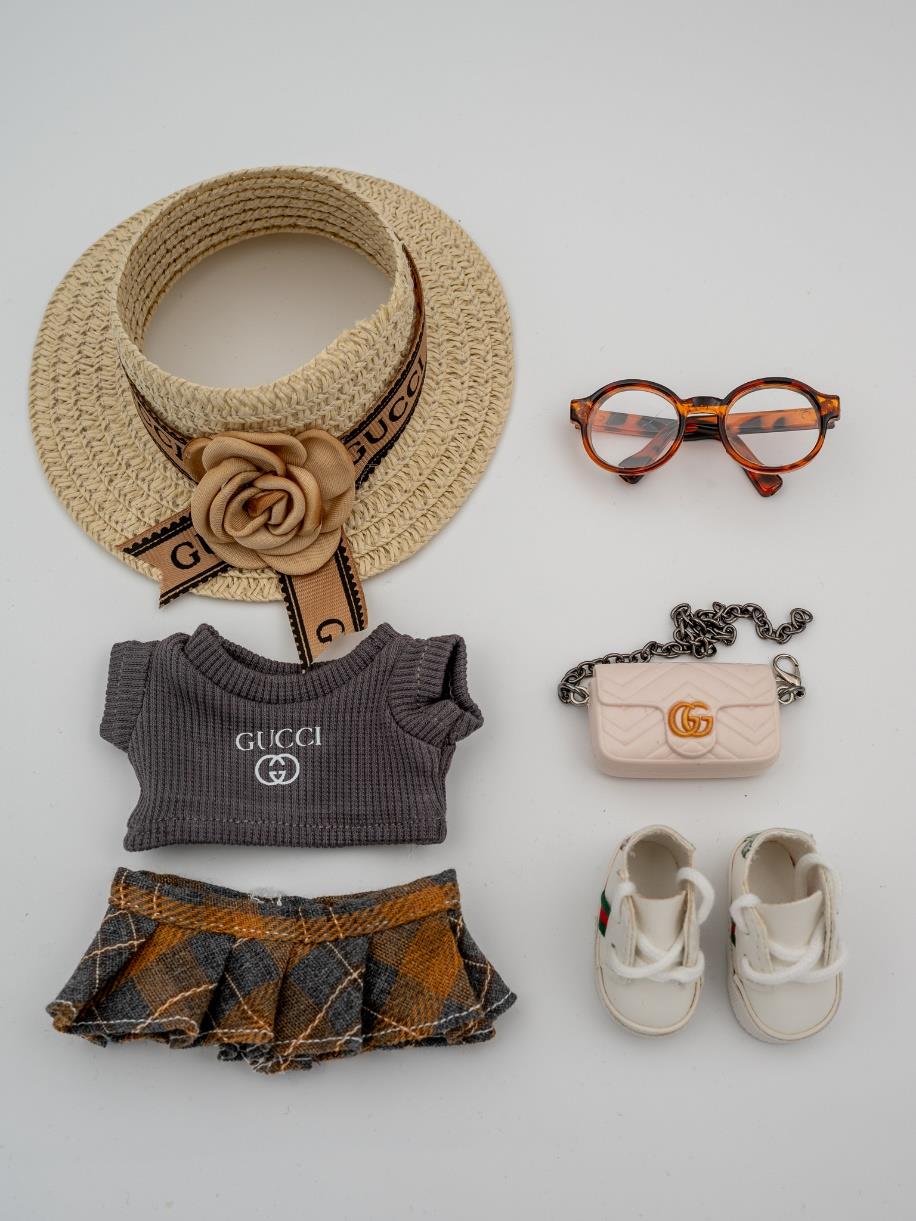 Gucci gray sweater and plaid skirt ensemble